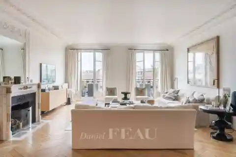 Haussmannian Elegance with Continuous Balcony Views