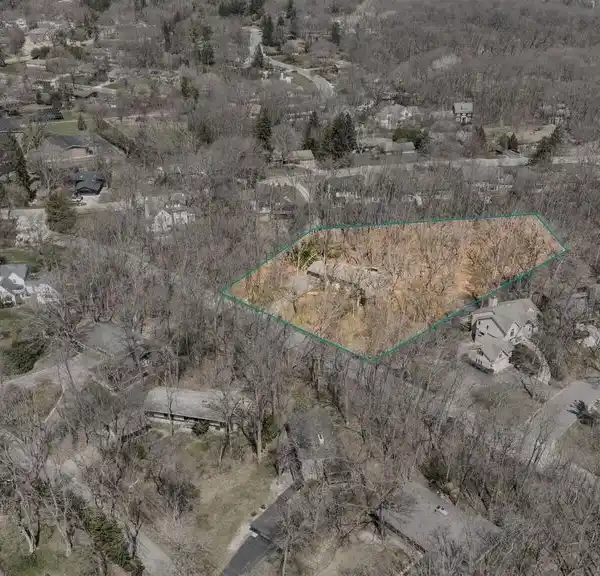 SPACIOUS MID-CENTURY RANCH ON A PRIVATE WOODED LOT