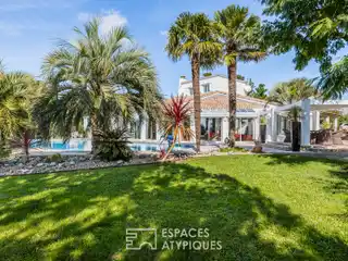 Contemporary Palm-Lined Villa with Infinity Pool