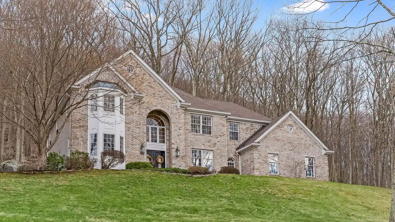 Center Hall Colonial on Three Wooded Acres