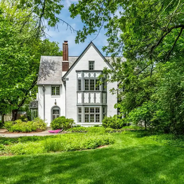 STATELY TUDOR HOME ON A TREED LOT