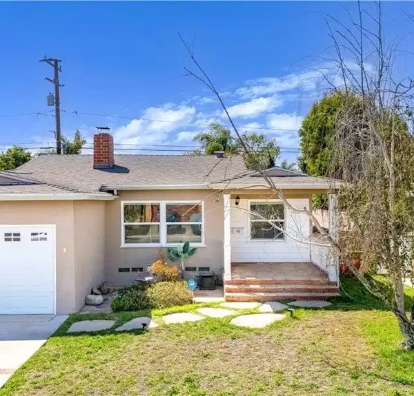 CHARMING MID-BLOCK HOME WITH DUAL FIREPLACES AND MODERN KITCHEN
