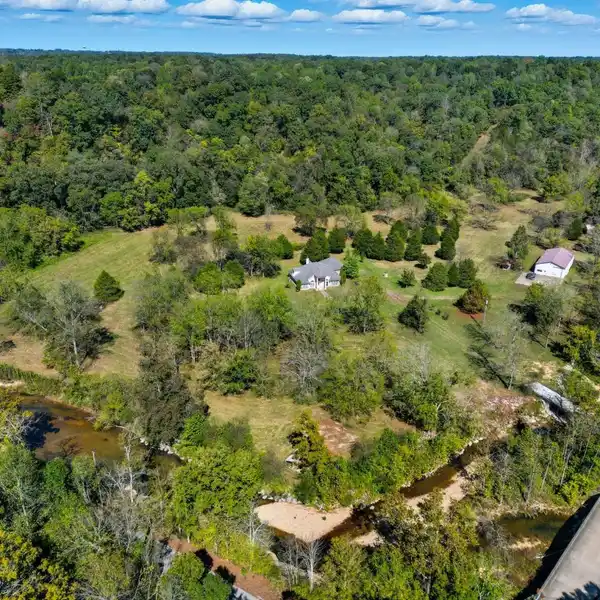 LUXURIOUS EXPANSIVE CREEKFRONT ESTATE
