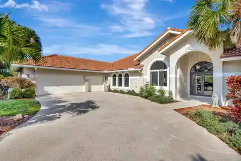 Sophisticated Residence in the Coveted Banyan Lakes Gated Community