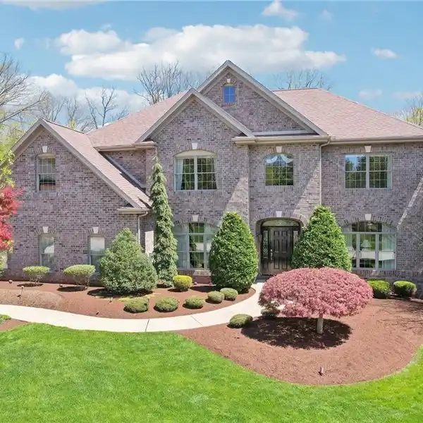 BEAUTIFUL BRICK HOME ON PARK-LIKE PROPERTY