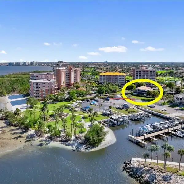 EXCEPTIONAL TWO-STORY WATERFRONT COURTYARD HOME IN WATERS EDGE