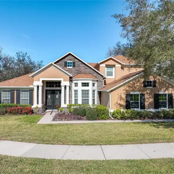 METICULOUSLY CARED FOR HOME IN THE GATED WEKIVA RUN COMMUNITY