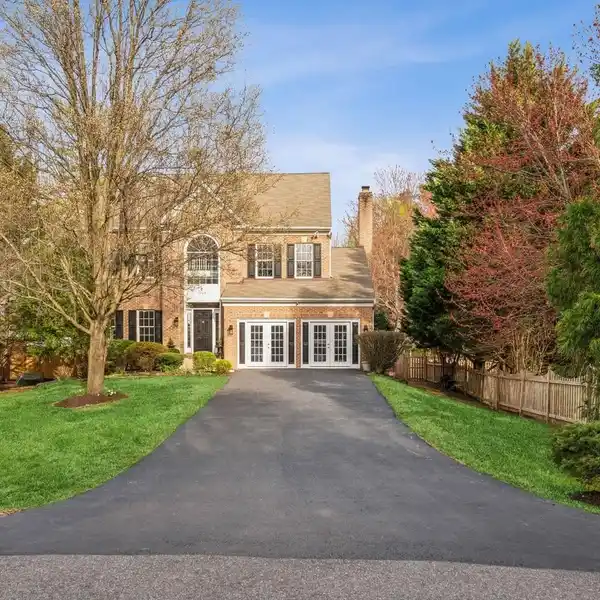 LUXE BRICK COLONIAL WITH BACKYARD PARADISE