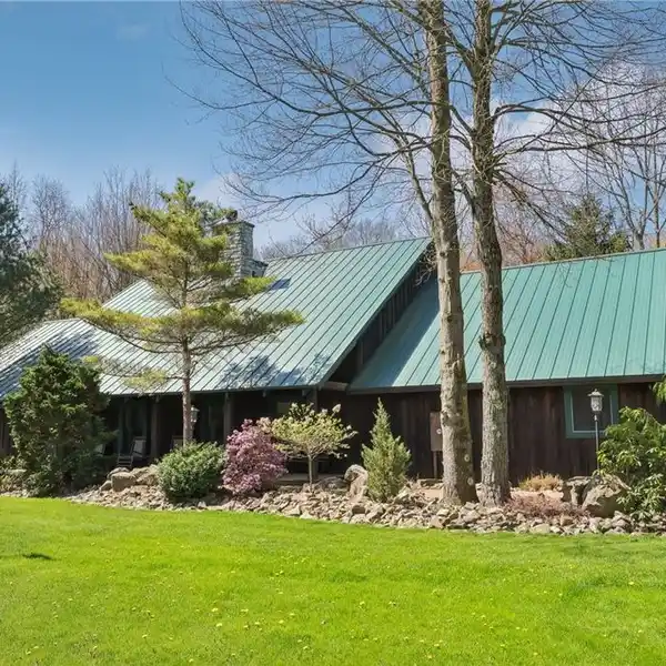 CUSTOM LOG HOME ON NEARLY TEN ACRES