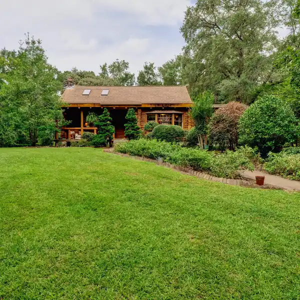 SECLUDED CABIN ON OVER 32 TRANQUIL ACRES IN WILMINGTON