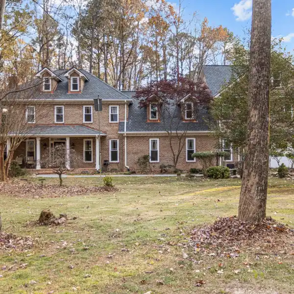 ALL BRICK ESTATE HOME IN SOUGHT-AFTER ENCHANTED OAKS