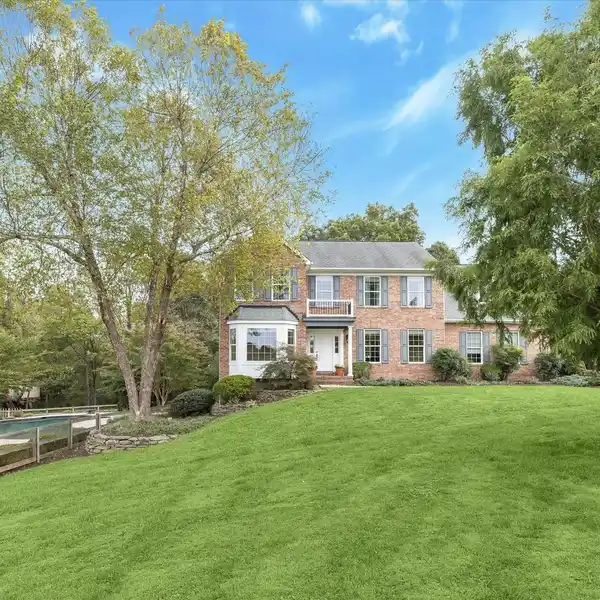 BREATHTAKING BRICK COLONIAL ON OVER THREE ACRES