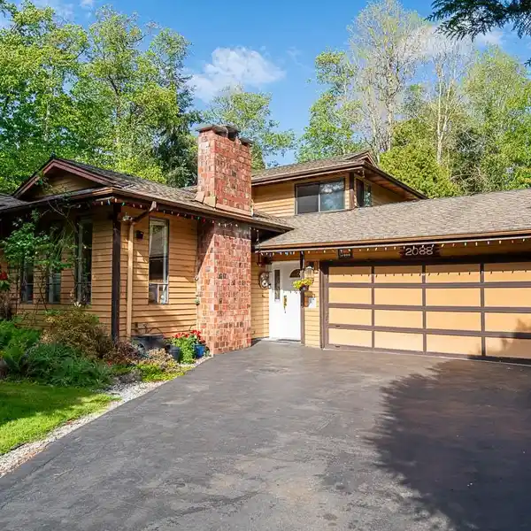 SPACIOUS SPLIT-LEVEL ON PRIVATE PARKLIKE ACRE