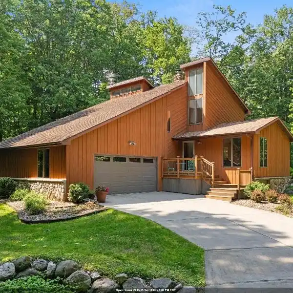 METICULOUSLY CARED FOR HOME ON A WOODED RETREAT