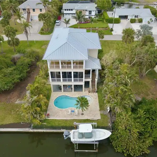 CUSTOM BUILT ESTERO BAY SHORES POOL HOME