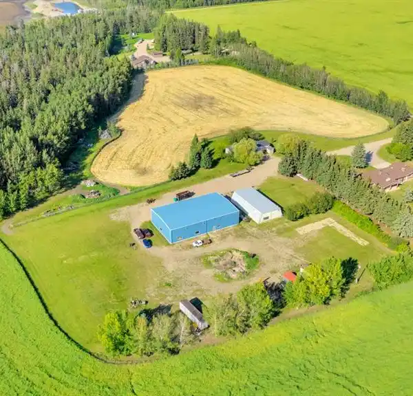 PRIVATE ESTATE FEATURING MULTIPLE OUTBUILDINGS AND RESIDENCES