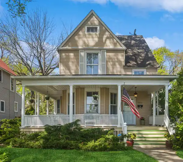 TREE-LINED STREET WITH WRAPAROUND PORCH DELIGHT