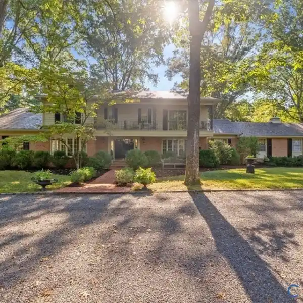 ELEGANT BRICK COLONIAL ON PICTURESQUE LANDSCAPE