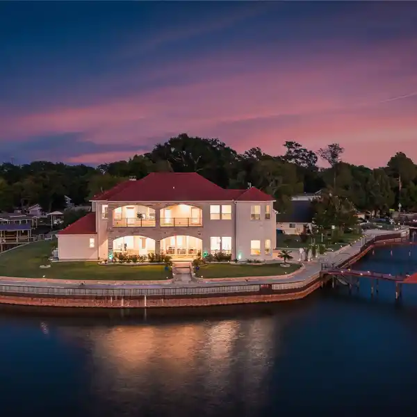TURNKEY WATERFRONT RETREAT ON CEDAR CREEK LAKE WITH 363’ SHORELINE