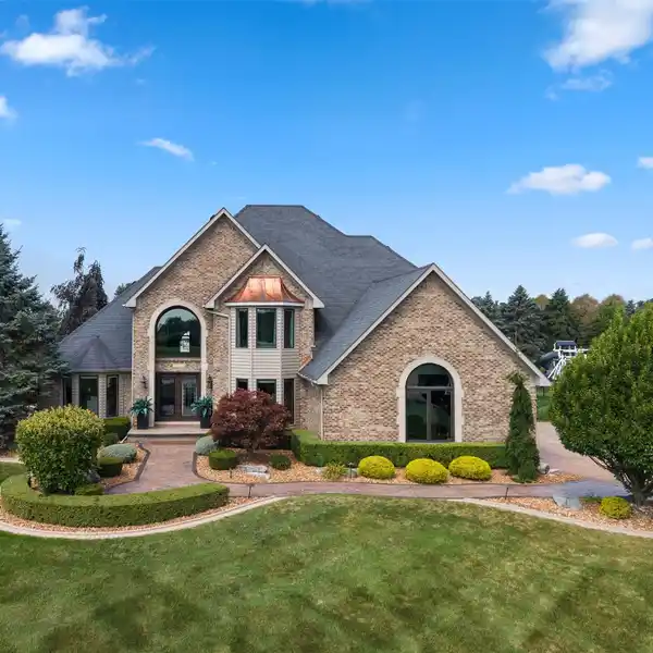 ENTERTAINER’S DREAM HOME WITH HEATED GARAGE, POOL & MULTIPLE GATHERING SPACES