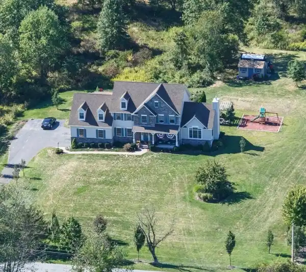 GORGEOUS COLONIAL ON THREE LEVEL ACRES