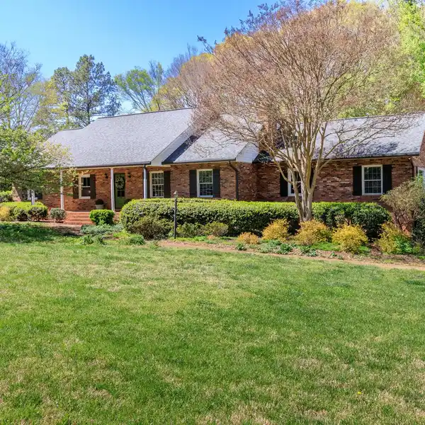 CHARMING BRICK RANCH HOME ON 5.6 PRIVATE ACRES