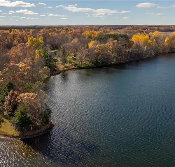 RARE LEGACY PROPERTY ON LONE LAKE – 110 ACRES WITH 1,375’ OF SANDY SHORELINE