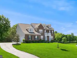 Sun-Filled Colonial on Private Wooded Lot