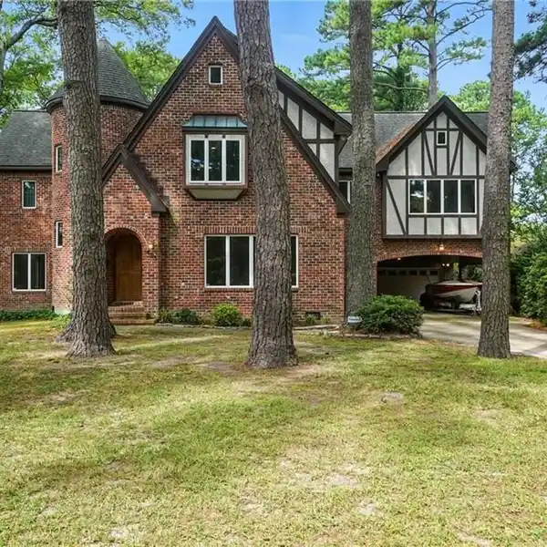 TUDOR-STYLE WATERFRONT HOME WITH ENDLESS POTENTIAL