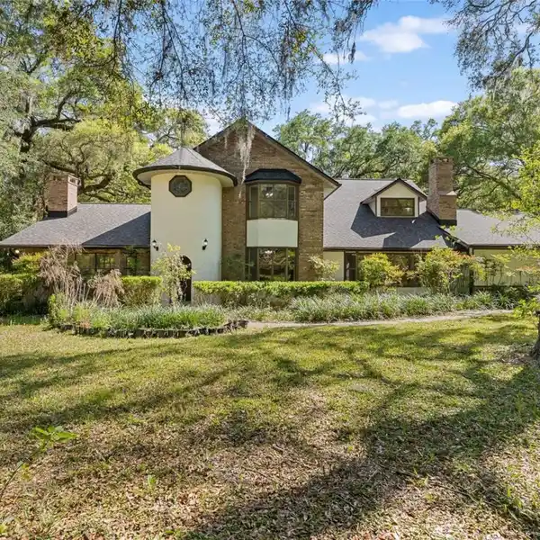 TUDOR-STYLE HOME ON THREE ACRES