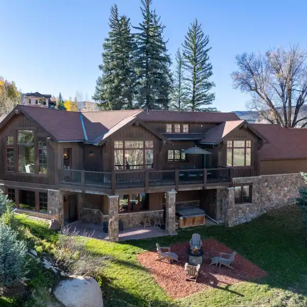 ELEGANT GREAT ROOM WITH DRY STACK STONE FIREPLACE