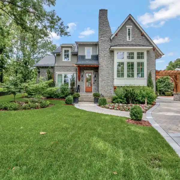 STORYBOOK MODERN TUDOR HOME WITH CARRIAGE HOUSE