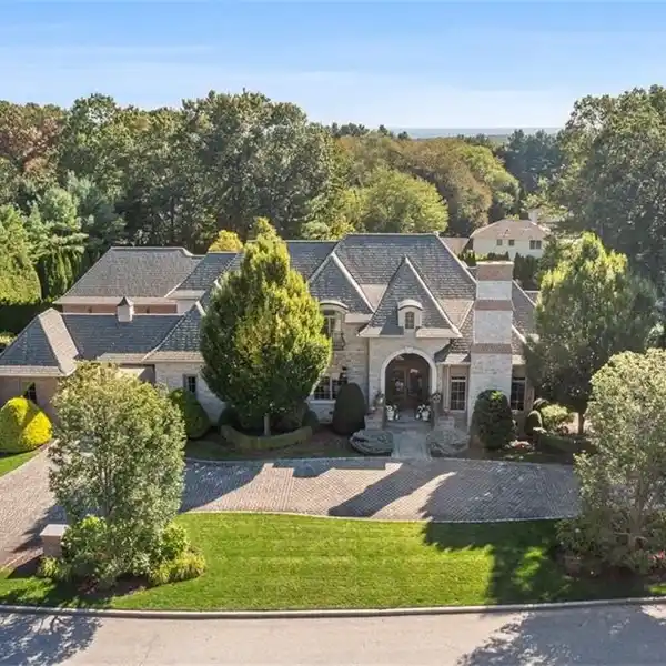 CUSTOM BRICK & STONE MASTERPIECE WITH 5 ENSUITE BEDROOMS