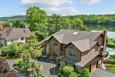 Contemporary Colonial Overlooking Serene Lake Deforest