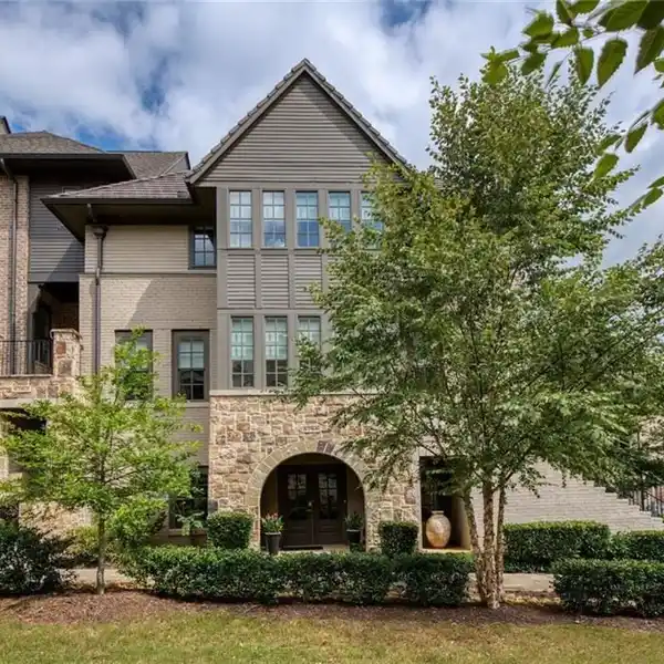 SOPHISTICATED END-UNIT TOWNHOME WITH DESIGNER FINISHES & CHARM