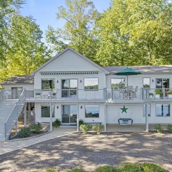 LAKEFRONT ELEGANCE WITH DOCKS, BEACH, AND VIEWS