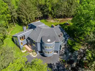 Contemporary Elegance Meets Peaceful Wooded Retreat