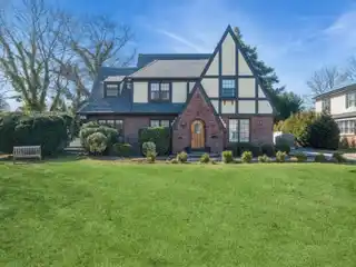 Cathedral Gardens Stately Tudor Style Home