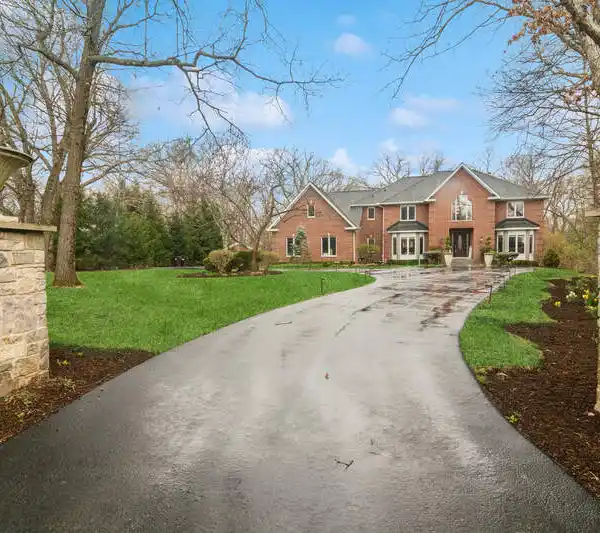 PROFESSIONALLY RENOVATED HOME NESTLED IN PRIVATE WOODED ACRES