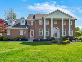 Stunning Brick-front Colonial with Sunroom Retreat