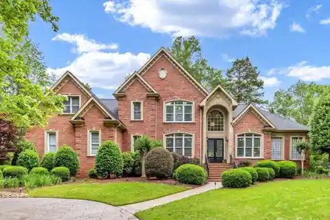 Serene Estate with Sunroom and Porch Views