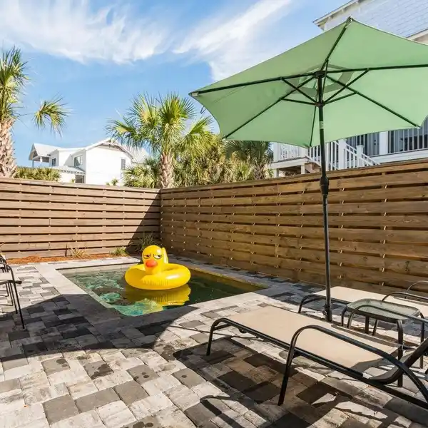 TURNKEY BEACH HOME WITH DESIGNER FINISHES AND BUNK ROOM FOR GUESTS