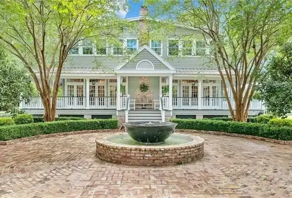 CRAFTSMANSHIP AND CHARM ON EXPANSIVE OAK-SPOTTED ESTATE