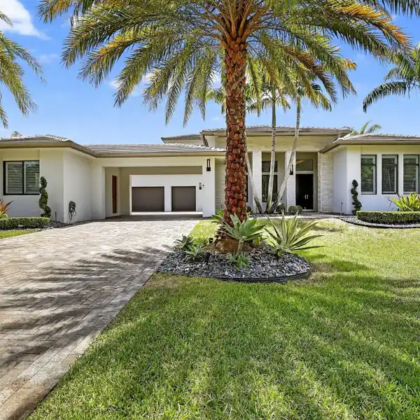 IMPRESSIVE TWO-STORY RESIDENCE IN EXCLUSIVE PLANTATION ACRES