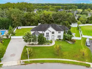 Striking White Stone and Stucco Colonial