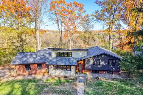 Modern Riverfront Elegance Surrounded by Natural Serenity