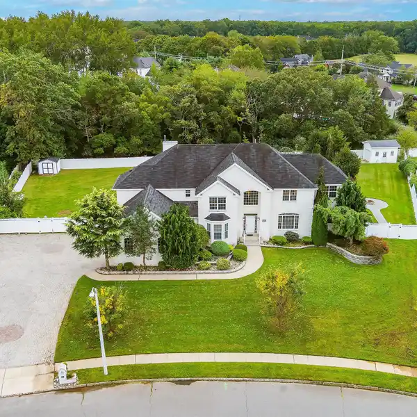 STRIKING WHITE STONE AND STUCCO COLONIAL