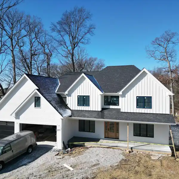 GORGEOUS NEW CONSTRUCTION ON AN OVERSIZED WOODED LOT