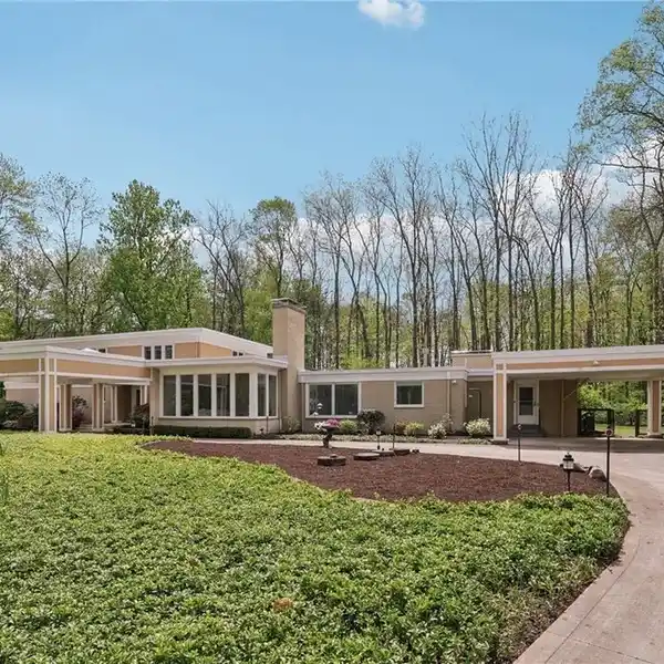 CONTEMPORARY HOME ON OVER FOUR SECLUDED ACRES