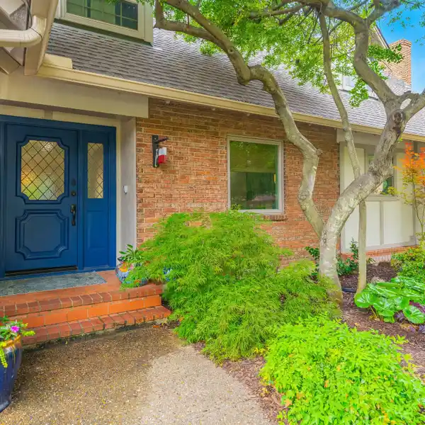 BEAUTIFULLY UPDATED TRADITIONAL TUDOR-STYLE RESIDENCE